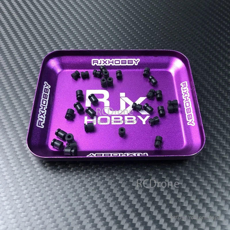 RJX 100pcs Silicone Anti-Vibration Damping Ball, Black silicone anti-vibration damping balls scattered on a purple RJXHOBBY parts tray