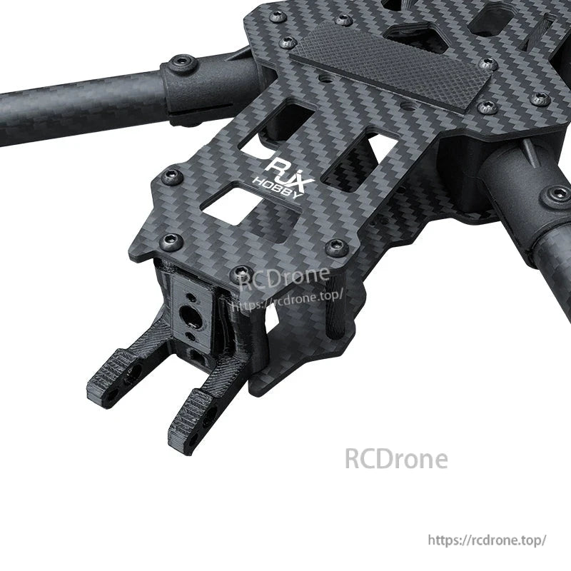 Close-up of RJX Hobby carbon fiber FPV drone frame top plate with hardware and arm mounts