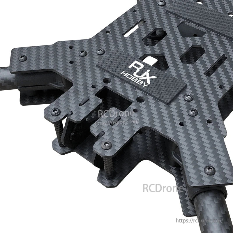 RJX Hobby carbon fiber FPV drone frame kit close-up with plate cutouts, standoffs and mounting screws