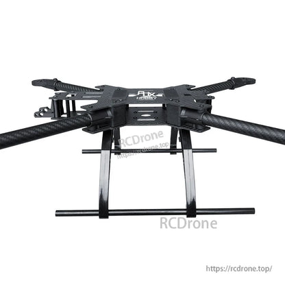 Carbon fiber quadcopter drone frame with four tubular arms and tall landing gear skids, RJX Hobby top plate