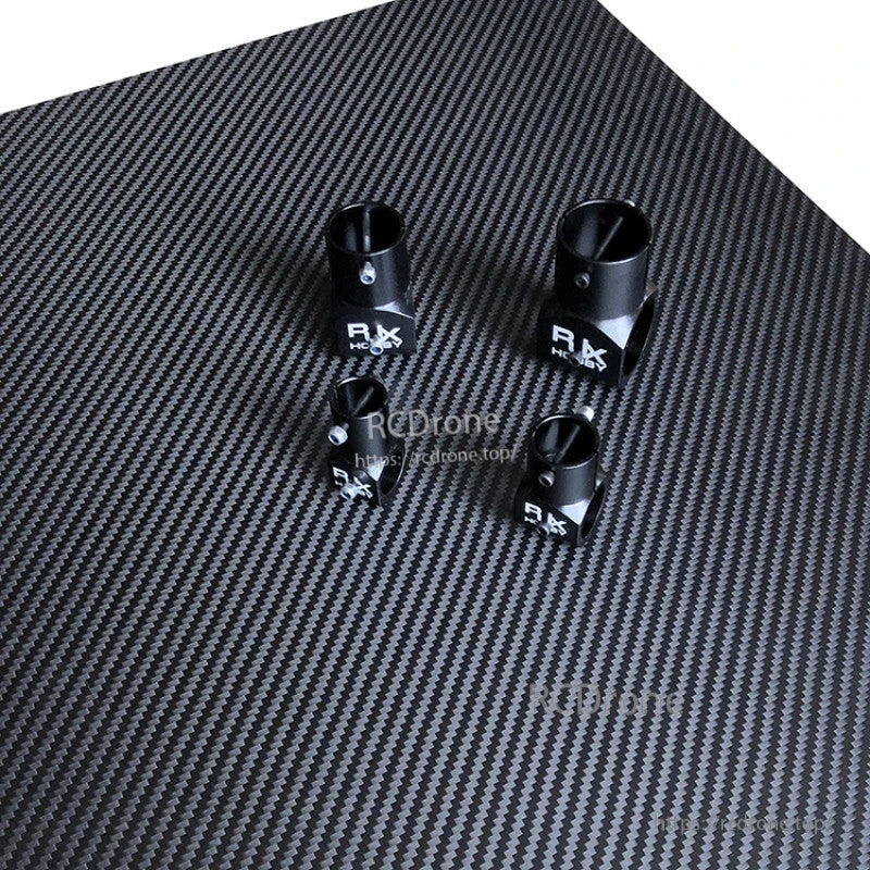 RJX 16/20/25mm Carbon Fiber T-Piece Connector, Set of four RJX black T-piece tube connectors with set-screw clamps on a carbon fiber panel