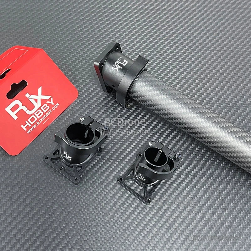 RJX aluminum quick-release clamp mounts with fixed base plates on a carbon fiber tube for tripod/landing gear