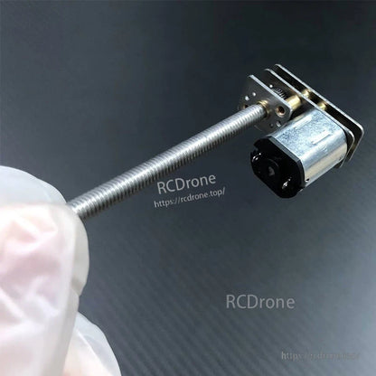 N20 micro DC gear motor with metal gearbox and long threaded lead screw, compact right-angle mount