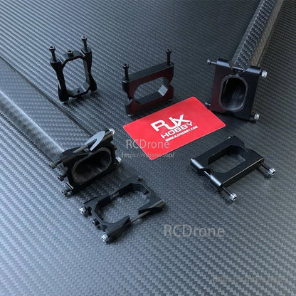 RJX 25x38x1000mm Octagonal Tube and Tube Clamp, RJX Hobby octagonal carbon fiber tube with multiple black tube clamps, M3 screws and nuts on carbon-fiber surface
