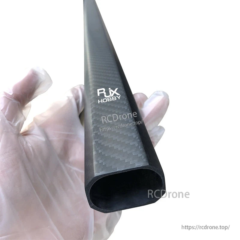 RJX 25x38x1000mm Octagonal Tube and Tube Clamp, RJX Hobby octagonal carbon fiber tube with woven finish, held in a gloved hand