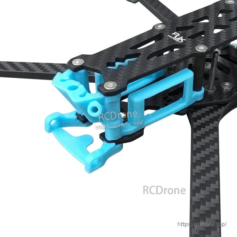 Blue RJX 3D-printed front bumper and camera mount installed on a carbon fiber Mark5-style FPV drone frame