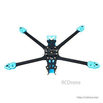 RJX 3D printed replacement parts installed on a carbon fiber quadcopter frame with blue arm-end mounts
