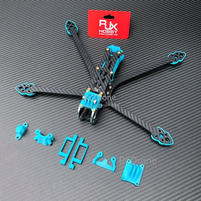 RJX 3D printed blue TPU replacement parts set laid out beside a carbon fiber FPV quad frame