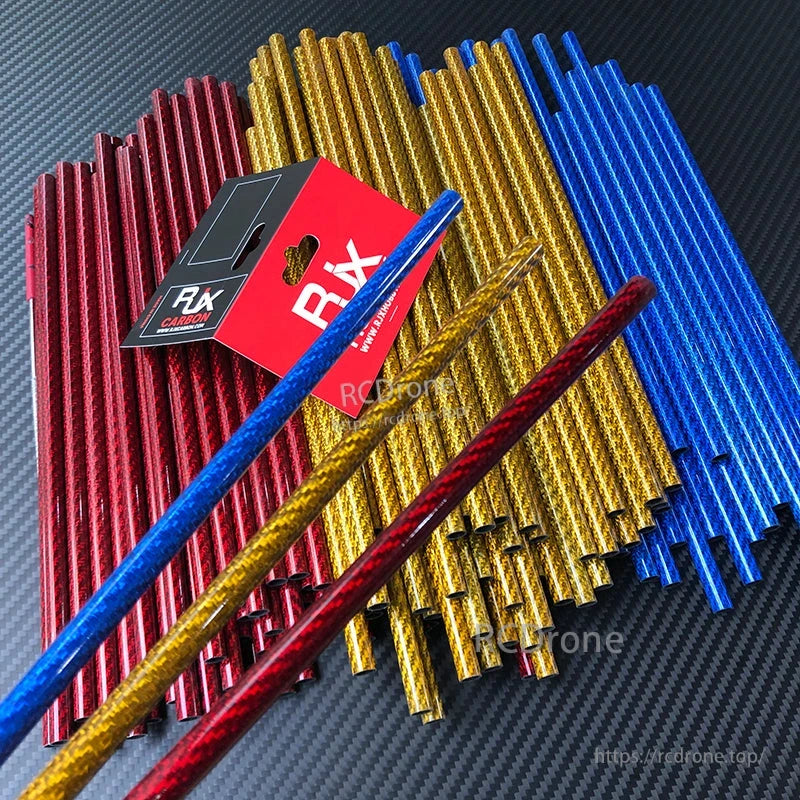 RJX 3K colorful carbon fiber tube rods in red, gold and blue, 1000mm length, stacked on carbon weave backdrop