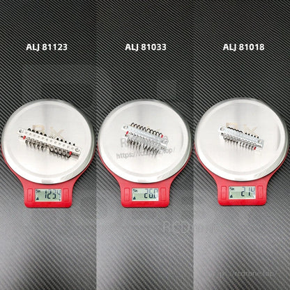 Steel wire rope anti-vibration isolator mount on a digital scale, with model labels ALJ 81123, 81033 and 81018