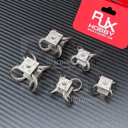 Four RJX Hobby steel wire rope vibration isolator gimbal dampeners with square mounting blocks and cable loops