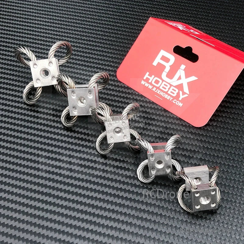 Four RJX wire rope vibration isolator mounts with metal blocks and threaded center holes for RC UAV gimbal damping