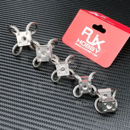 Four RJX wire rope vibration isolator mounts with metal blocks and threaded center holes for RC UAV gimbal damping