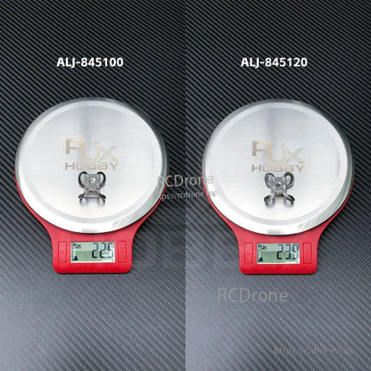 RJX Hobby steel wire rope gimbal isolator on digital scale, showing approx. 22.5g and 23.9g weights