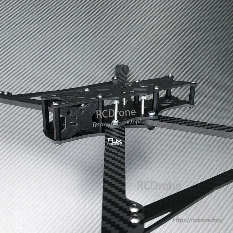 RJX A1 carbon fiber FPV drone frame kit with long arms, stacked top plates, and standoffs