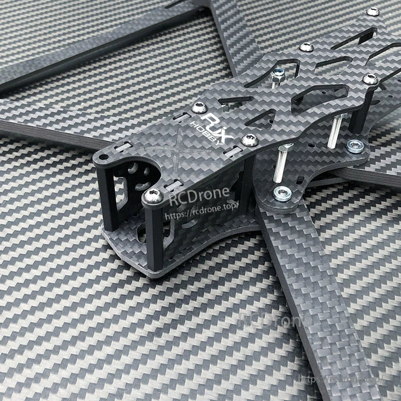 Close-up of RJX A1 10-inch carbon fiber FPV racing drone frame kit with arms, standoffs, and mounting hardware