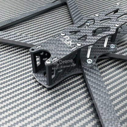 Close-up of RJX A1 10-inch carbon fiber FPV racing drone frame kit with arms, standoffs, and mounting hardware