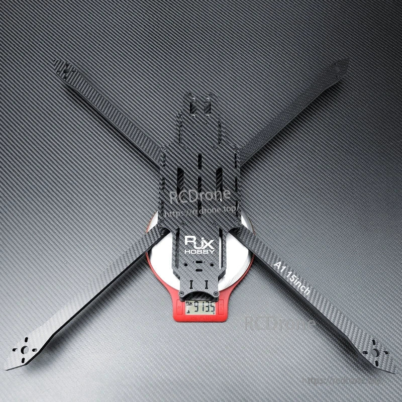 RJX A1 15-inch matte twill carbon fiber FPV drone frame with long arms and center plate on a scale