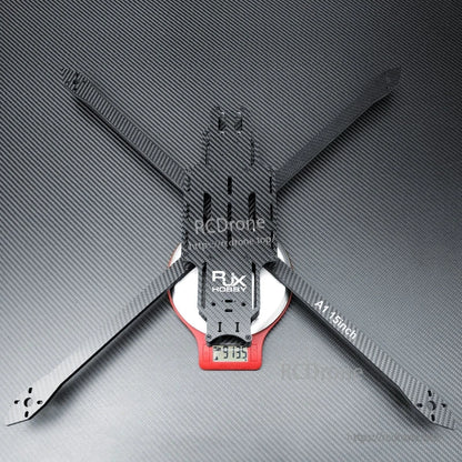 RJX A1 15-inch matte twill carbon fiber FPV drone frame with long arms and center plate on a scale