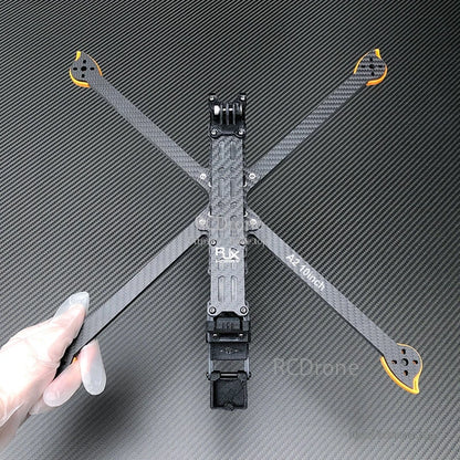 RJX A2 10-inch carbon fiber FPV drone frame kit with X arms, orange motor mount ends, and center plate
