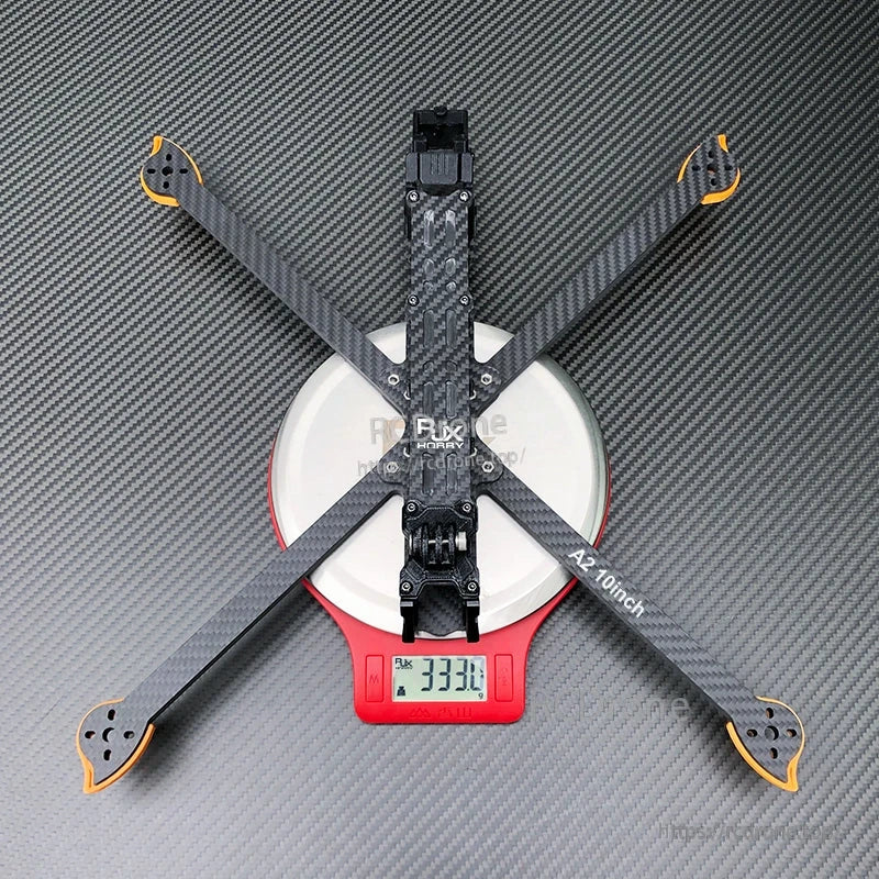 RJX A2 10inch carbon fiber FPV drone frame on a digital scale showing 333.1 g weight
