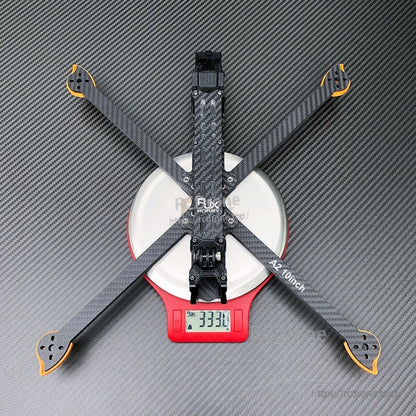 RJX A2 10inch carbon fiber FPV drone frame on a digital scale showing 333.1 g weight