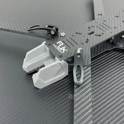 RJX Hobby carbon fiber FPV drone frame top plate with mounting slots, metal bracket and gray 3D-printed mount