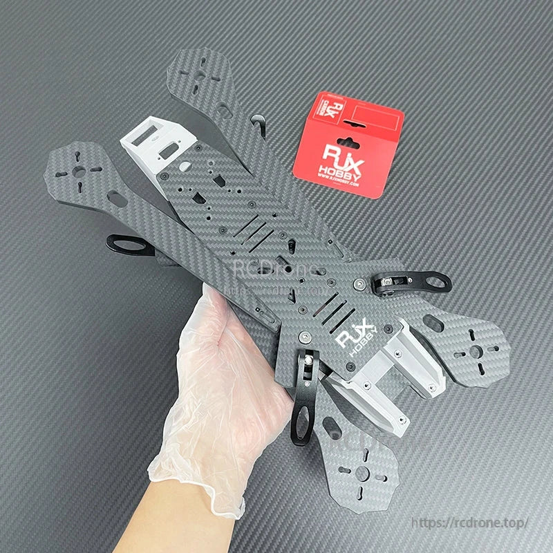 RJX A4 13-inch FPV freestyle drone frame kit with carbon fiber arms, metal brackets, and RJX Hobby packaging