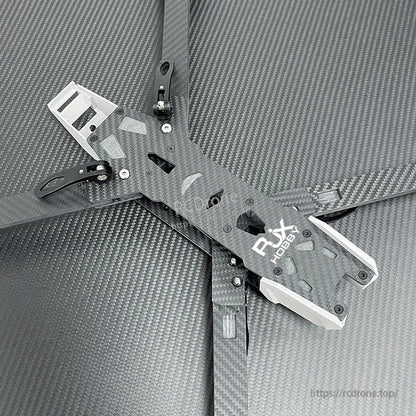 Carbon fiber FPV racing drone frame kit with DJI logo top plate, wide arms, and white 3D-printed mounts