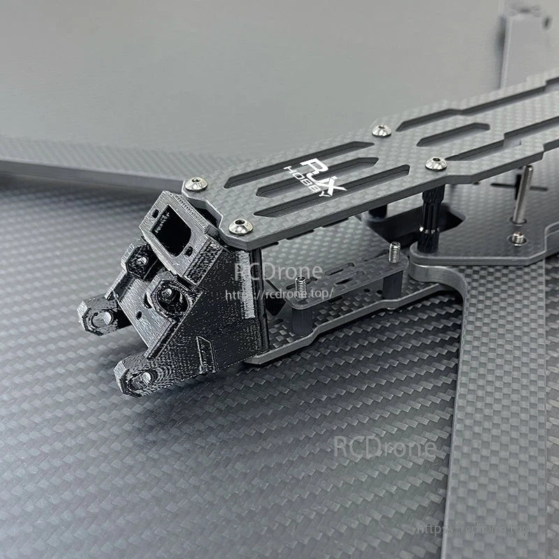 RJX A5 carbon fiber FPV racing drone frame section with slotted top plate, standoffs, and front camera mount