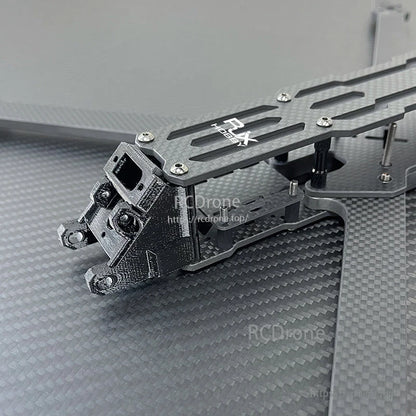 RJX A5 carbon fiber FPV racing drone frame section with slotted top plate, standoffs, and front camera mount