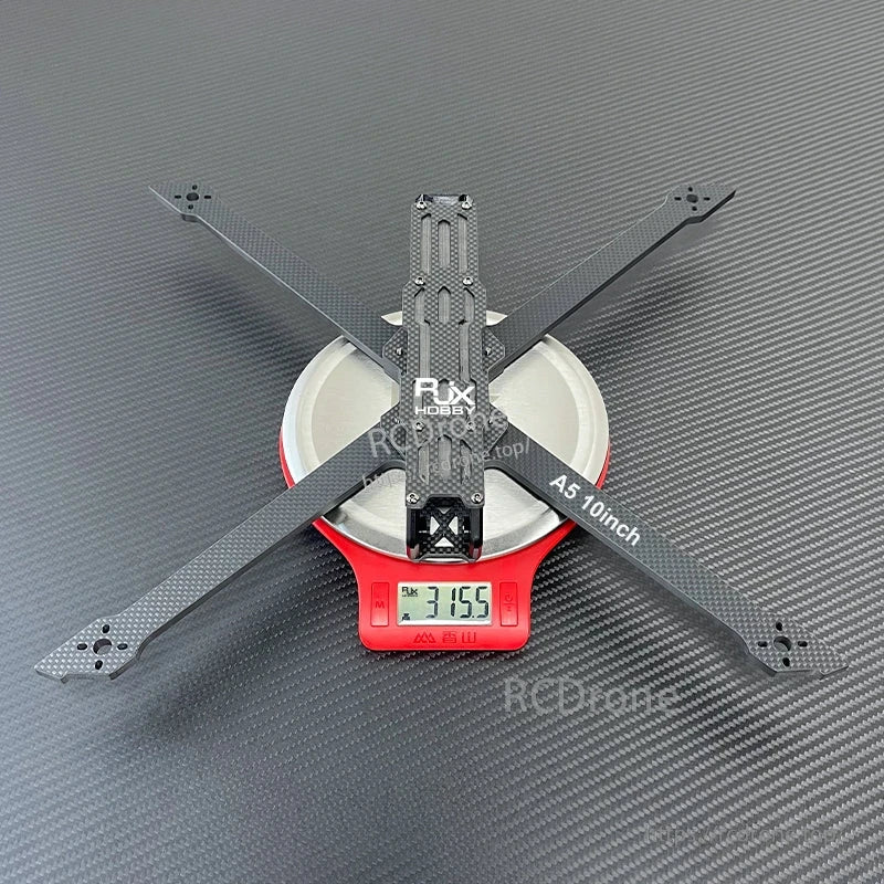 RJX A5 10-inch carbon fiber FPV drone frame in X layout on a digital scale showing 315.5 g