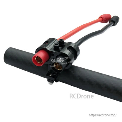 RJX AS150 holder mount clamp on a carbon tube holding red and black AS150 power connectors