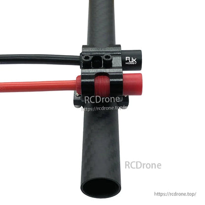 RJX AS150 holder mount clamp secured to a carbon fiber tube, holding red and black wires