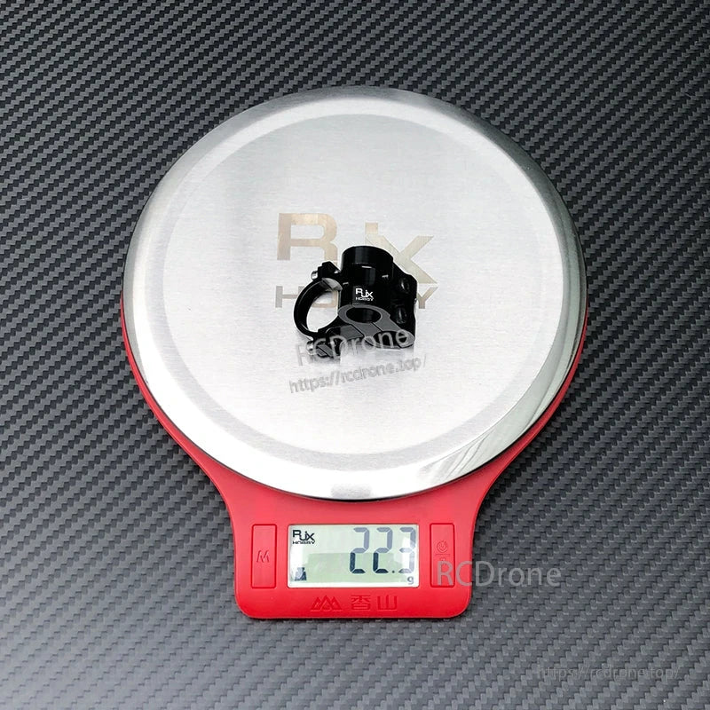 RJX AS150 holder mount clamp in black aluminum on a digital scale reading 22.7 g