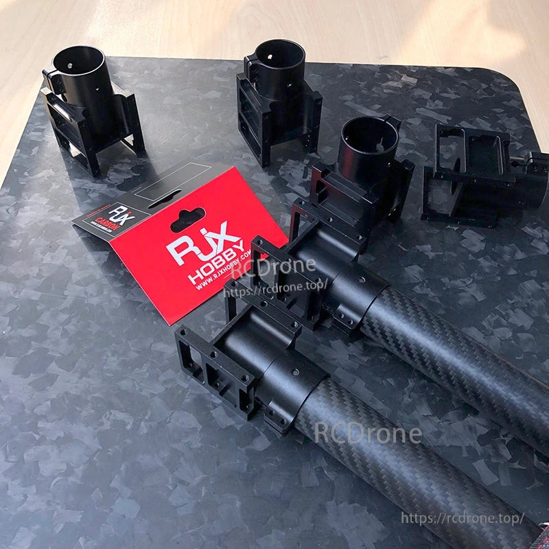 RJX aluminum alloy center plate mount holders clamped on carbon fiber tubes with RJX Hobby packaging
