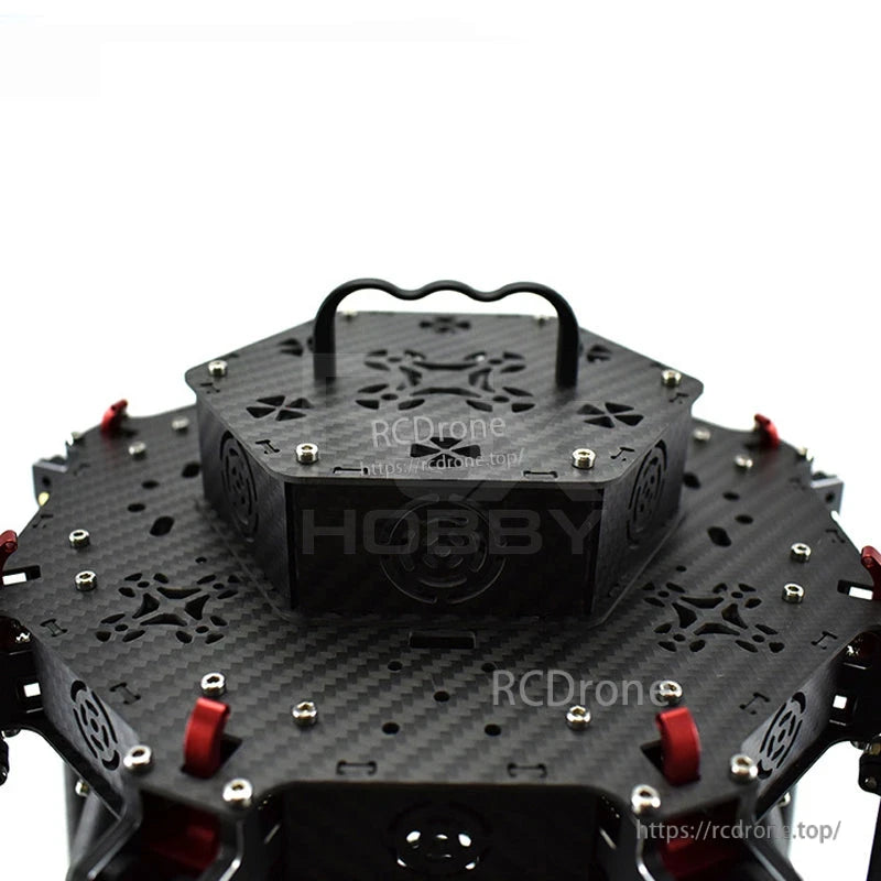 Black aluminum drone handle grip mounted on a carbon fiber quadcopter frame top plate