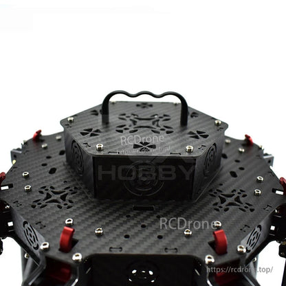 Black aluminum drone handle grip mounted on a carbon fiber quadcopter frame top plate