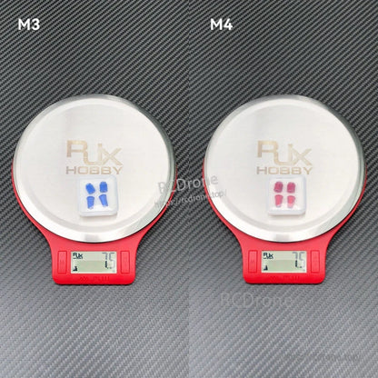 RJX aluminum gimbal thumb stick parts on digital scales, M3 and M4 sets weighing 7.5 g each