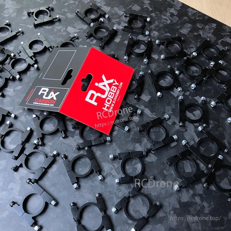 RJX anodized aluminum tube pipe clamps with mounting screws spread out next to RJX Hobby retail packaging