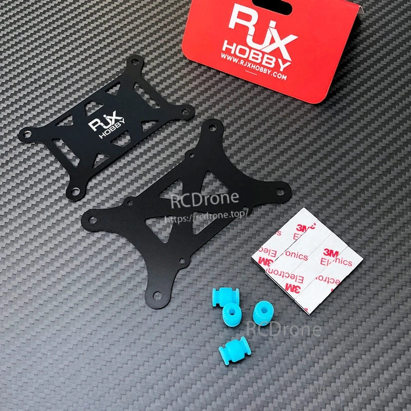 RJX anti-vibration flight controller mount set with two black plates, blue dampers, and 3M adhesive pads