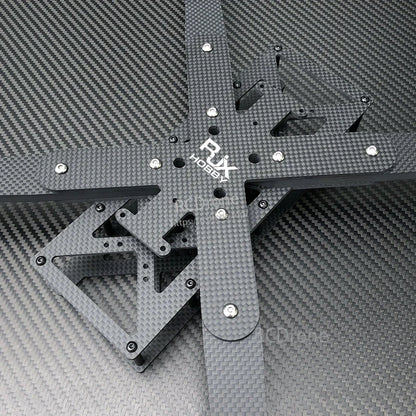 Top view of RJX carbon fiber RC FPV drone frame kit with cross arms, mounting holes, and hardware.