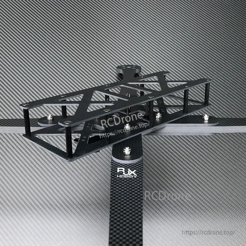 RJX carbon fiber FPV drone frame kit with X-style arms, top plate cutouts, and standoff spacers