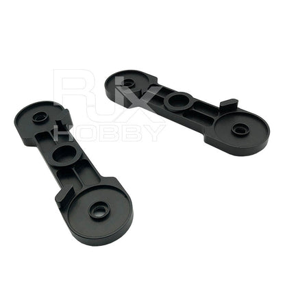 Pair of black RJX CW/CCW propeller clips with circular mounting holes for RC helicopter blades