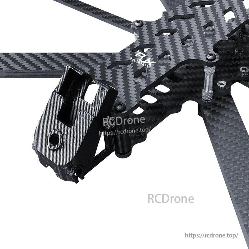 Close-up of RJX carbon fiber FPV drone frame top plate with standoffs and a 3D-printed front mount