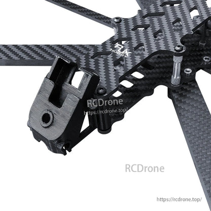 Close-up of RJX carbon fiber FPV drone frame top plate with standoffs and a 3D-printed front mount