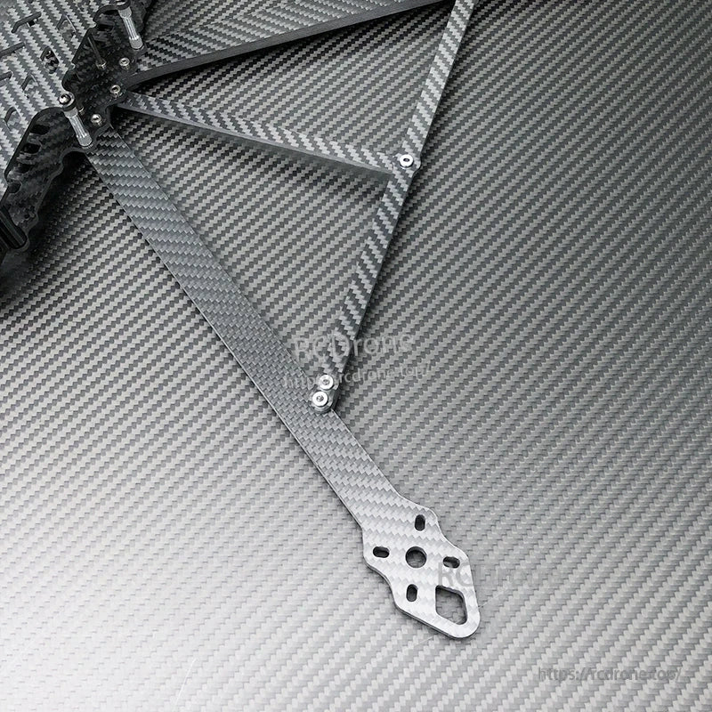 Carbon fiber FPV drone frame arm with mounting holes and metal standoffs installed