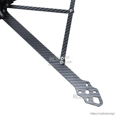 Close-up of RJX carbon fiber FPV racing drone frame arm with woven finish and multiple mounting holes
