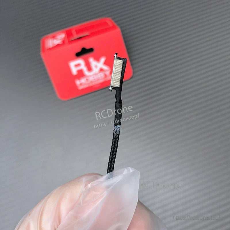 RJX DJI O3 compatible coaxial cable with braided sleeve and small board connector close-up