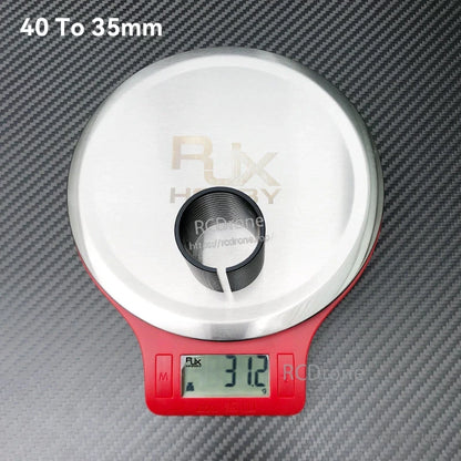RJX 40 to 35mm diameter changing adapter sleeve, split ring insert shown on digital scale reading 31.2g